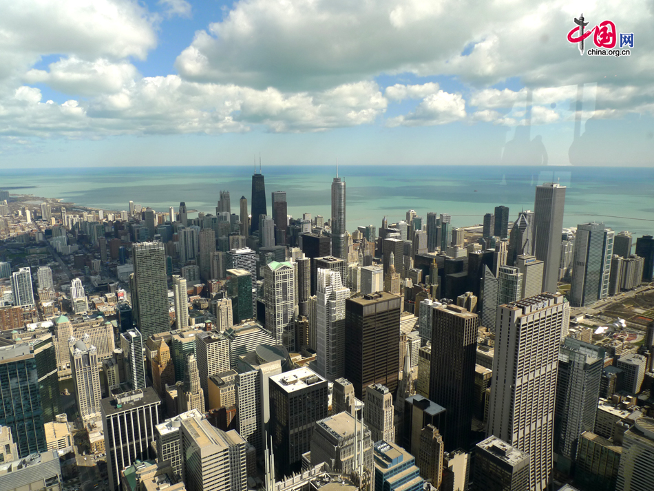 A view of Chicago buildings from the top of Willis Tower, formerly named Sears Tower, a 108-story, 1,451-foot (442 m) skyscraper in Chicago, Illinois. It is now the tallest building in the United States and the fifth-tallest freestanding structure in the world. As the largest city in the US state of Illinois, Chicago is a major hub for industry, telecommunications and infrastructure in the country. [Photo by Xu Lin/China.org.cn]