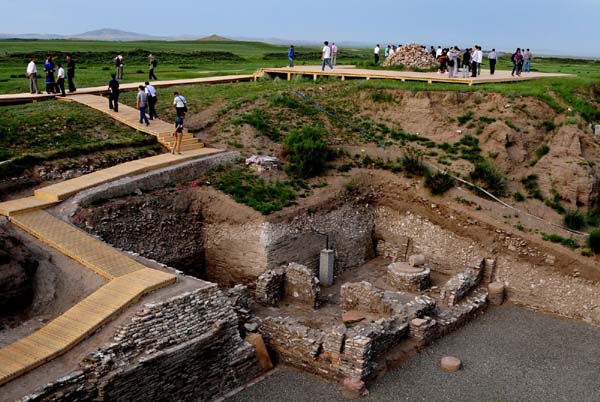 Tourists use a new boardwalk to get up close to residential ruins at the Site of Xanadu. The 740-year-old ruins, located twenty kilometers northeast of Shangdu County in Inner Mongolia Autonomous Region, officially opened to visitors on July 15. On January 2011, the State Council approved to apply to include the Site of Xanadu as a UNESCO World Heritage Site in 2012.[Photo: Xinhua] 