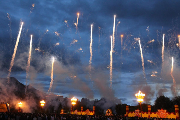 The Potala Palace is illuminated by fireworks display to celebrate the 60th anniversary of the peaceful liberation of Tibetin Lhasa on July 19, 2011. [Photo/Xinhua] 