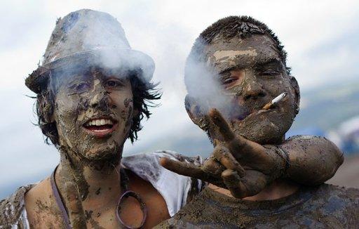 More than 130,000 visitors gathered in Boryeong on Thursday. Locals and tourists waded through the mud and played in 200 tons of the greyish goo in mud wrestling pots. Some of the revellers painted themselves with colored mud.