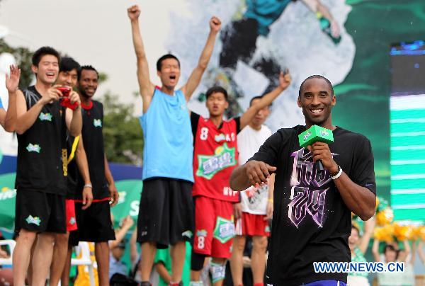 Kobe Bryant greets his fans in east China's Shanghai, July 21, 2011. As part of his Asian tour, NBA star Kobe Bryant met and gave instructions to young Chinese players in the final of a basketball contest Thursday in Shanghai.