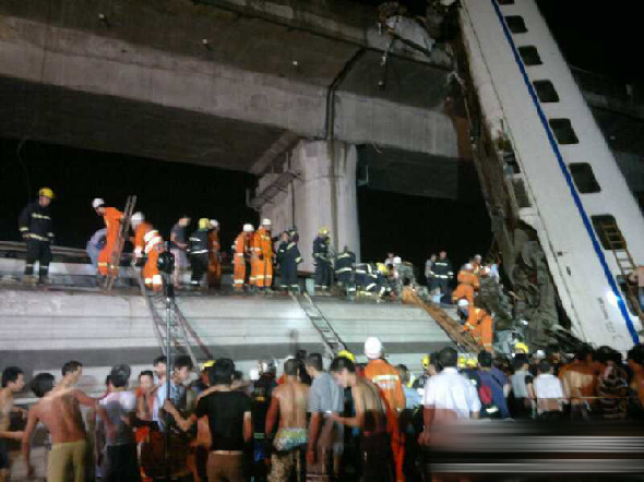 Two coaches of a bullet train fell off a bridge after derailing in Wenzhou, east China's Zhejiang Province. [Xinhua]