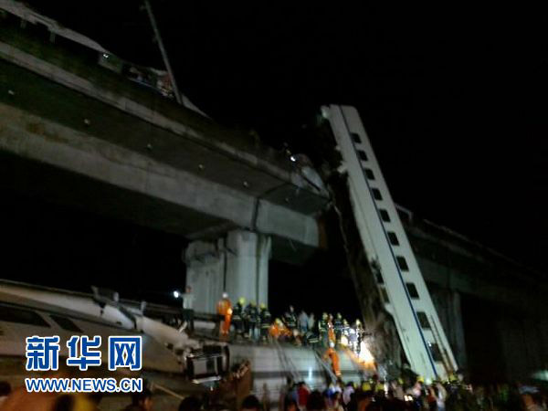 Two coaches of a bullet train fell off a bridge after derailing in Wenzhou, east China's Zhejiang Province. [Xinhua]