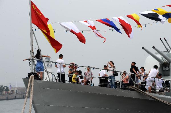 People visit China's missile frigate 'Wuhu' during the 2011 International Marine Festival in Qingdao, east China's Shandong Province, July 23, 2011. 