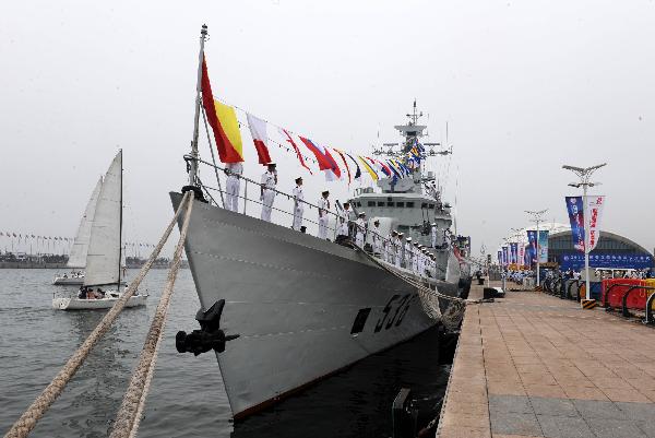 China's missile frigate 'Wuhu' waits for public visit during the 2011 International Marine Festival in Qingdao, east China's Shandong Province, July 23, 2011. Various activities themed on marine culture, economy, sports, science and technology, tourism as well as military will be held during the 18-day festival, which kicked off on Saturday. [Xinhua/Li Ziheng]