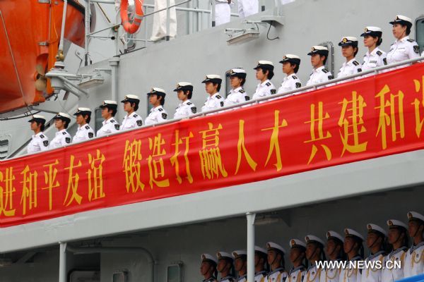 Women navy trainees are seen on board of Zheng He training ship in a harbor in Dalian, northeast China&apos;s Liaoning Province, July 25, 2011. A fleet formed by China&apos;s naval Zheng He training ship and Luoyang missile frigate set sail from Dalian on Monday for a visit to Russia and the Democratic People&apos;s Republic of Korea. (Xinhua/Zha Chunming) (cxy) 