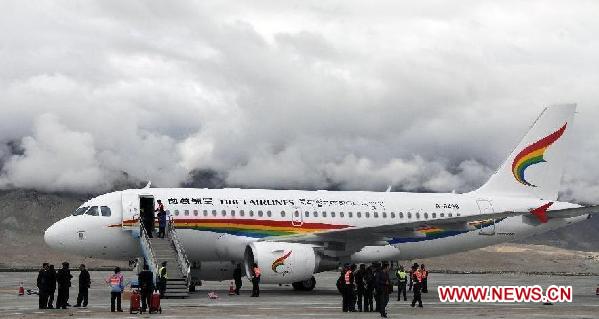 Tibet Airlines Flight TV9807 lands in Kunsha Airport after its maiden voyage from Lhasa to Ngari Prefecture, southwest China's Tibet Autonomous Region, July 26, 2011. Tibet Airlines, the first airline based in Tibet Autonomous Region, made its maiden flight on Tuesday from Gonggar Airport in Lhasa to Kunsha airport in Ngari Prefecture.[Xinhua/Wang Jianhua]