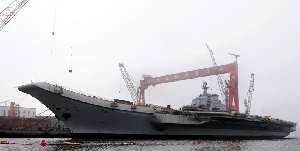 China refitting aircraft carrier for research, training 