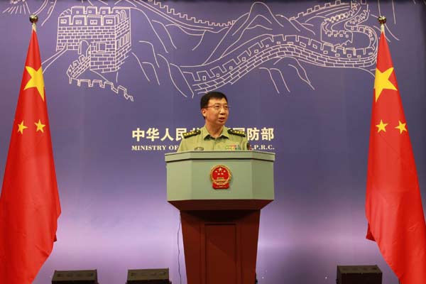 Defense Ministry spokesman Geng Yansheng answers questions during a news conference in Beijing, July 27, 2011.[Xinhua]