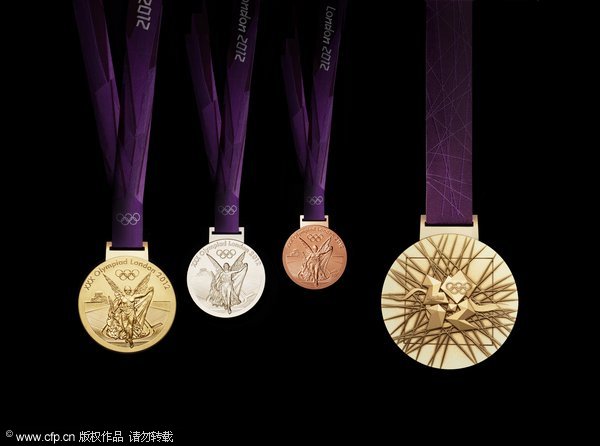 The London 2012 Olympic Games medals are displayed during a news conference in London July 27, 2011. 