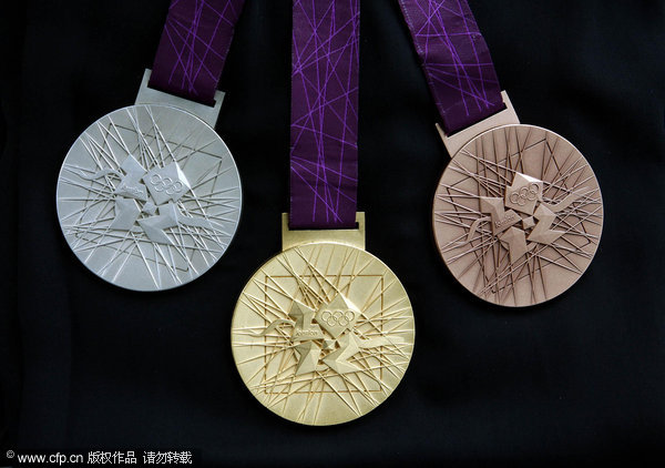 The London 2012 Olympic Games medals are displayed during a news conference in London July 27, 2011.