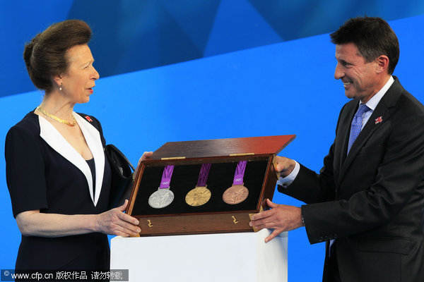 Britain's princess Anne (left), and chairman of london 2012 olympic games, Sebastian Coe unveil the olympic medals during the london 2012 olympic one year to go ceremony at trafalgar square in london, wednesday, july 27, 2011.