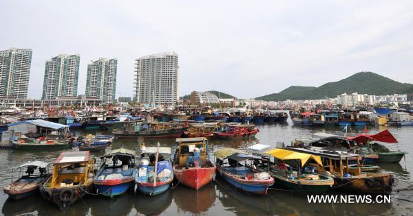 Fishing boats are seen anchored at a harbor in Sanya, south China's Hainan Province, July 28, 2011. Over 24,000 fishing boats returned to ports as tropical storm Nock-Ten was approaching. 