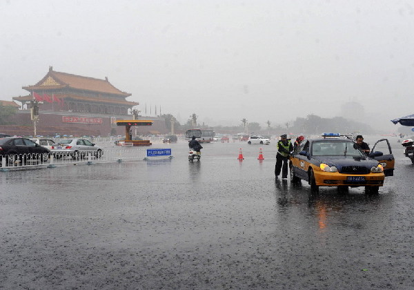 A downpour hit Beijing on Friday during the morning rush hour.