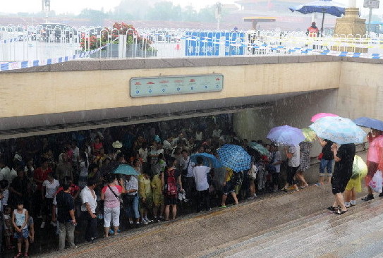 A downpour hit Beijing on Friday during the morning rush hour.