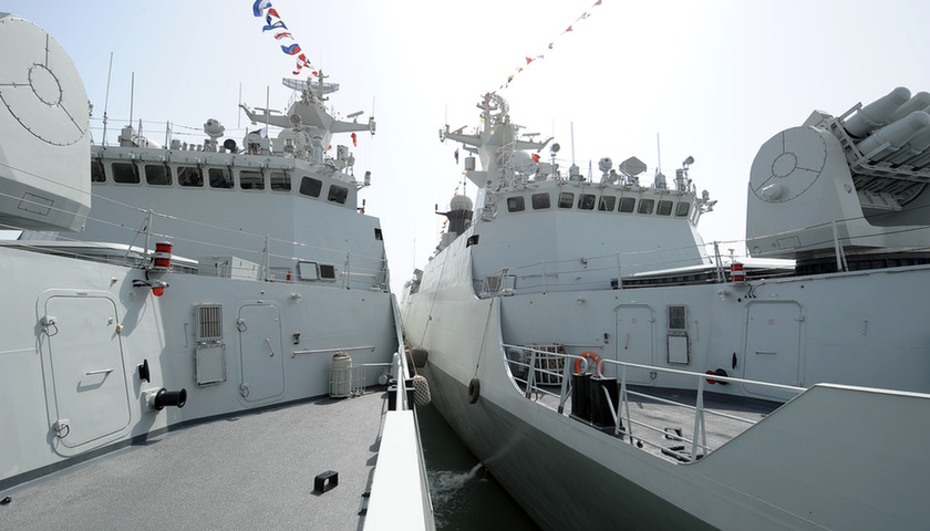 Missile frigate &apos;Wenzhou&apos; and &apos;Ma Anshan&apos; of the eighth escort flotilla in the Gulf of Aden of Chinese People&apos;s Liberation Army (PLA) Navy in the Gulf of Aden are seen in the port of Doha, capital of Qatar, July 30, 2011. Missile frigate Wenzhou, Maanshan and supply ship Qiandaohu arrived in Doha on Sunday, kicking off the first-ever visit by PLA navy to Qatar, which will last for five days. [Xinhua]