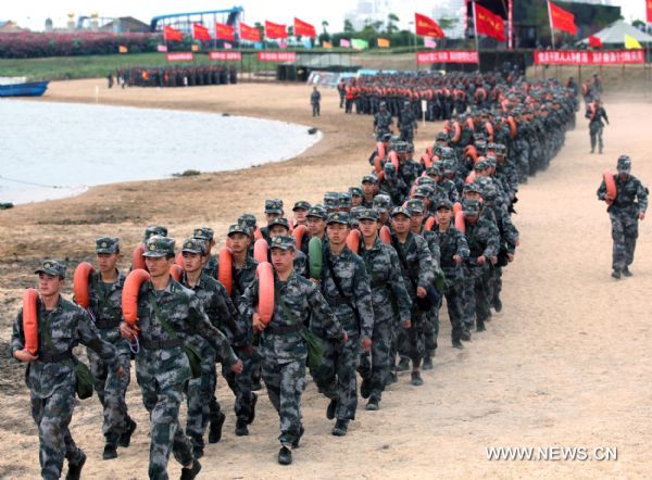 Soldiers assemble prior to a drill in Shanghai, east China, July 19, 2011. Soldiers of a detachment in Shanghai attended a series of drills in the scorching sunshine recently, aiming at strengthening minds and improving military skills.