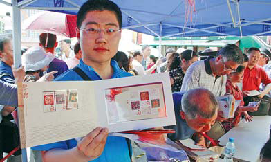 Stamp enthusiasts in Nanjing, Jiangsu province add to their collections. Many people see stamps as a good investment amid high inflation. [China Daily]