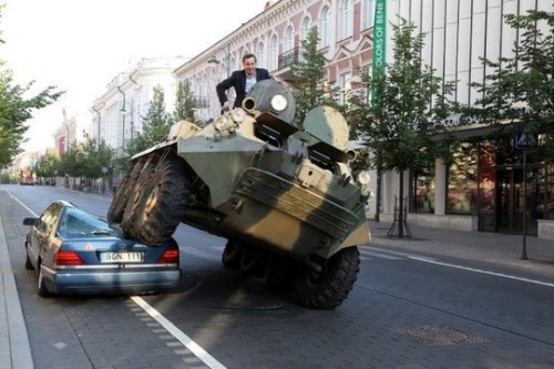 The mayor of Vilnius drives over an illegally-parked car in an armoured vehicle.