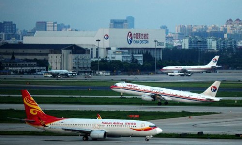 A plane takes off at Shanghai Hongqiao Airport in Shanghai, east China, Aug. 7, 2011. Shanghai Hongqiao Airport resumed normal operation on Sunday after the influence of the typhoon Muifa. Photo: Xinhua