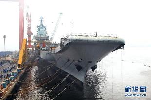 File photo of China's refitted aircraft carrier. The aircraft carrier left its shipyard at Dalian Port in northeast Liaoning Province on Wednesday morning to start its first sea trial. Military sources said that the first sea trial was in line with schedual of the carrier's refitting project and would not take a long time. After returning from the sea trial, the aircraft carrier will continue refit and test work. 