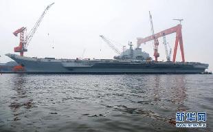 File photo of China's refitted aircraft carrier. The aircraft carrier left its shipyard at Dalian Port in northeast Liaoning Province on Wednesday morning to start its first sea trial. Military sources said that the first sea trial was in line with schedual of the carrier's refitting project and would not take a long time. After returning from the sea trial, the aircraft carrier will continue refit and test work. 