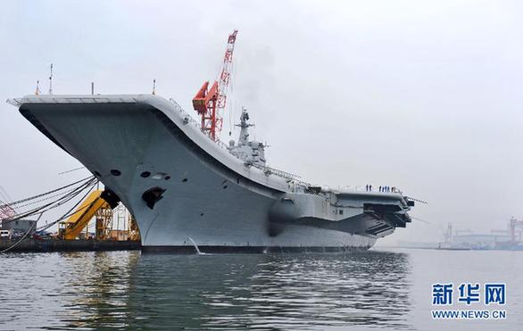 File photo of China's refitted aircraft carrier. The aircraft carrier left its shipyard at Dalian Port in northeast Liaoning Province on Wednesday morning to start its first sea trial. Military sources said that the first sea trial was in line with schedual of the carrier's refitting project and would not take a long time. After returning from the sea trial, the aircraft carrier will continue refit and test work. 