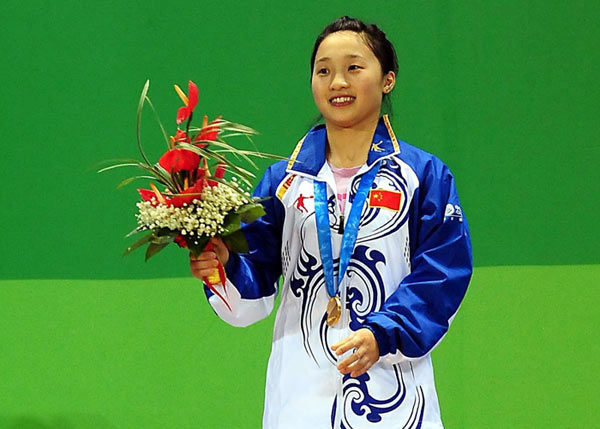 Xiao Hongyu of China celebrates after winning a gold medal in women's 48kg final at the 26th Summer Universiade in Shenzhen, Aug 13, 2011. 