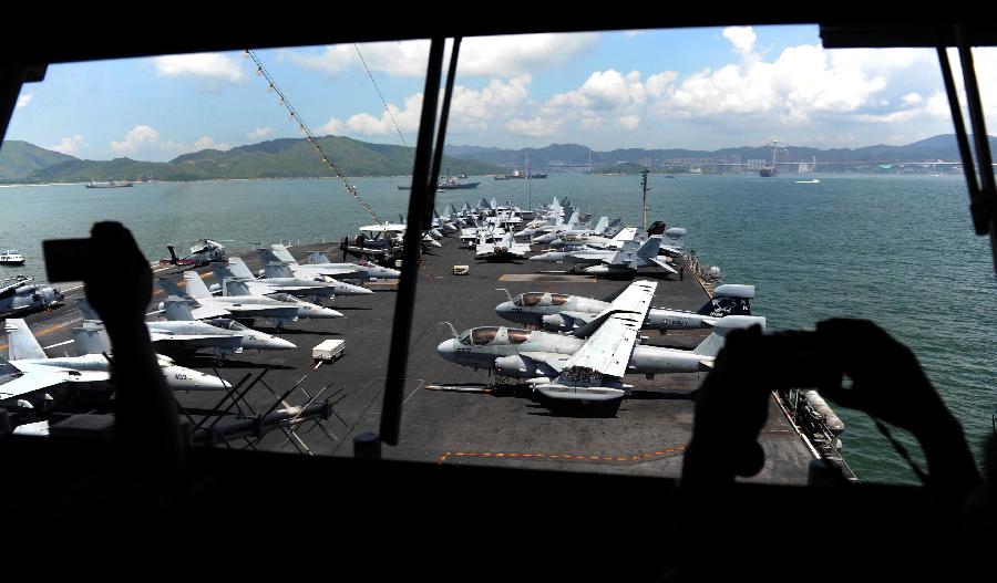 Photo taken on Aug. 13, 2011 shows the warplanes and early warning aircraft on the USS Ronald Reagan Aircraft Carrier in Hong Kong. The USS Ronald Reagan Aircraft Carrier and its three support ships arrived in Hong Kong on Friday for a four-day port visit, which is its fourth visit here. [Chen Xiaowei/Xinhua]