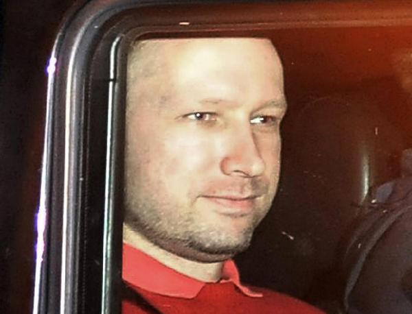 Norwegian Anders Behring Breivik, the man accused of a killing spree and bomb attack in Norway, sits in the rear of a vehicle as he is transported in a police convoy as he is leaving the courthouse in Oslo, in this July 25, 2011 file picture. [Agencies]