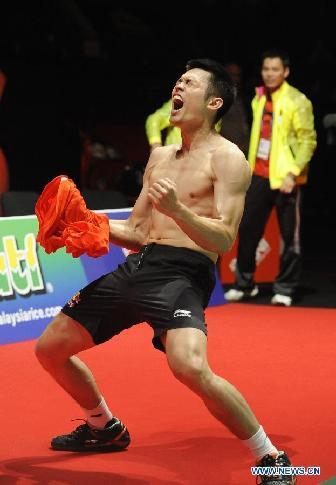 China's Lin Dan celebrates after winning the final of men's singles against Malaysia's Lee Chong Wei in 2011 Badminton World Championships at Wembley Arena, London, Britain, Aug. 14, 2011. Lin Dan won 2-1 to claim the title for the fourth time.