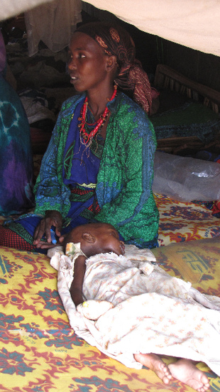 'We left Qansah Dere by car with my husband and his first wife but it broke down. We had to walk for over a week with nothing to eat but what people gave us on the way,' says 30-year-old mother of two Hajida Isaac. 'I don't think we can go back to Somalia in the short or medium term. We need food to eat and peace and we won't find that in Somalia.' [Lali Cambra/MSF] 