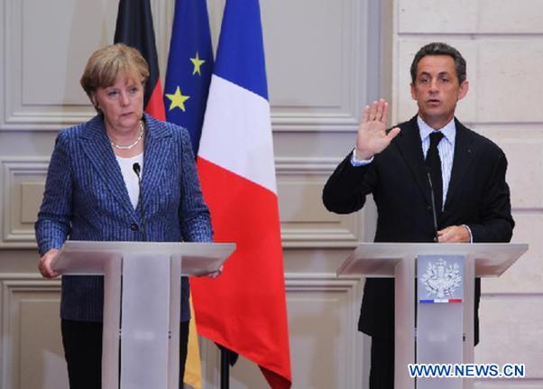 France's President Nicolas Sarkozy (R) and German Chancellor Angela Merkel attend a joint press conference at the Elysee presidential palace in Paris, France, Aug. 16, 2011. France and Germany said they want more united regulation, including an EU tax on financial transaction and common economic government to tame financial market volatility and guarantee growth. [Gao Jing/Xinhua]