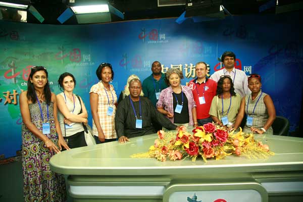 Members of the Seminar for Developing Countries' Press Officials pose at the multimedia studio of China.org.cn on August 18, 2011. [China.org.cn]