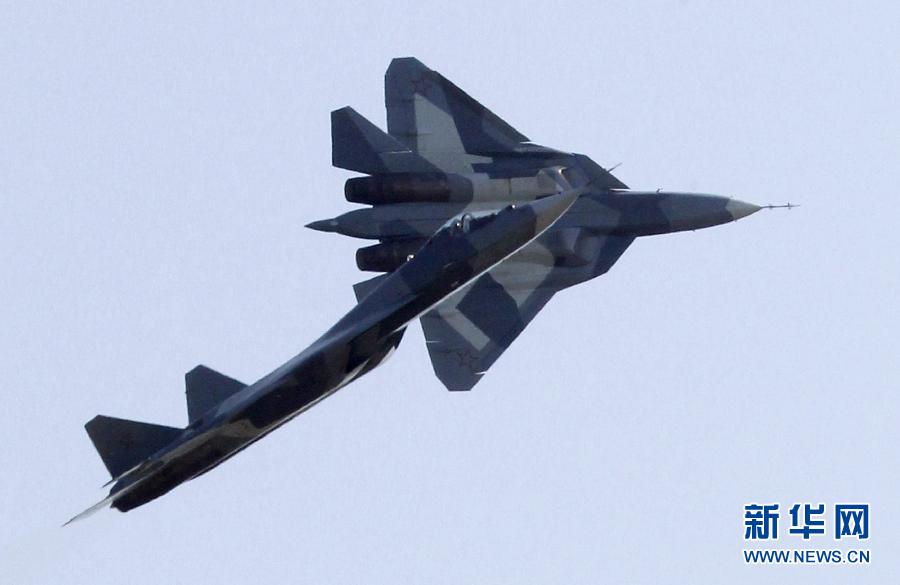 Two Sukhoi T-50 jets fly during a display at the opening of the MAKS International Aviation and Space Salon at Zhukovsky airport outside Moscow August 17, 2011. The T-50, a joint project between Russia and India, made its first public flight on Wednesday.