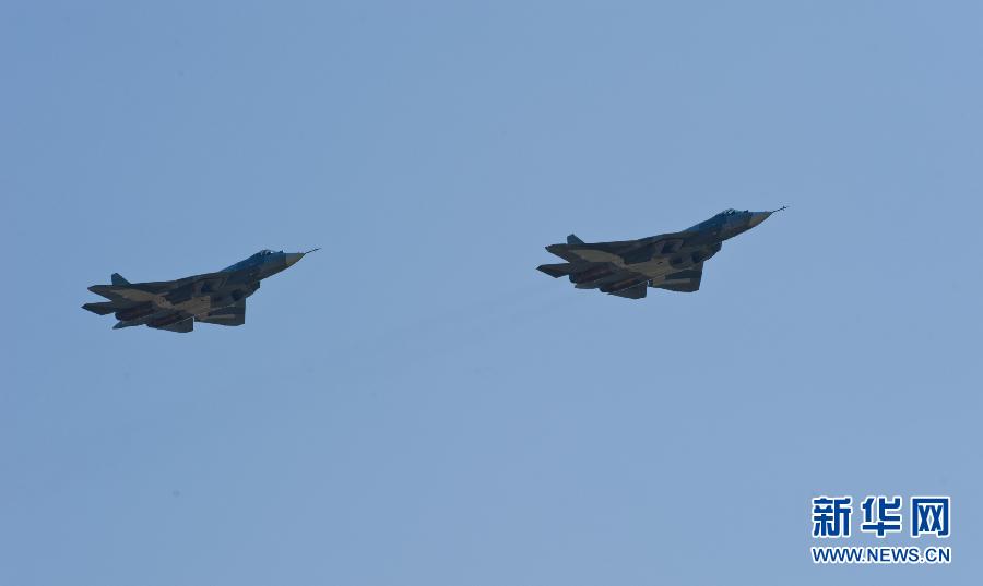 Two Sukhoi T-50 jets fly during a display at the opening of the MAKS International Aviation and Space Salon at Zhukovsky airport outside Moscow August 17, 2011. The T-50, a joint project between Russia and India, made its first public flight on Wednesday.