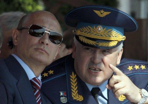 Russian Prime Minister Vladimir Putin (L) and Commander-in-Chief of the Russian Air Force Alexander Zelin watch a display during the opening of the MAKS International Aviation and Space Salon at Zhukovsky airport outside Moscow August 17, 2011. 