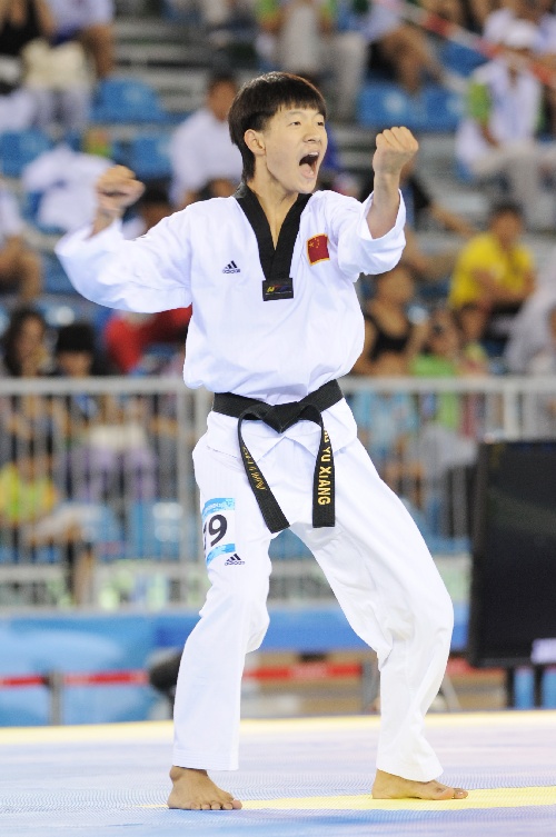 Zhu Yuxiang from China wins the gold medal of taekwondo men's individual poomsae at the Universiade in Shenzhen on Thursday.