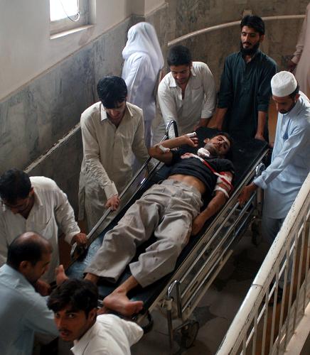 An injured people is being treated in local hospital after a suicide bomb attack hit a mosque packed with hundreds of prayers in northwest Pakistan on the afternoon of August 19, 2011. [CFP] 