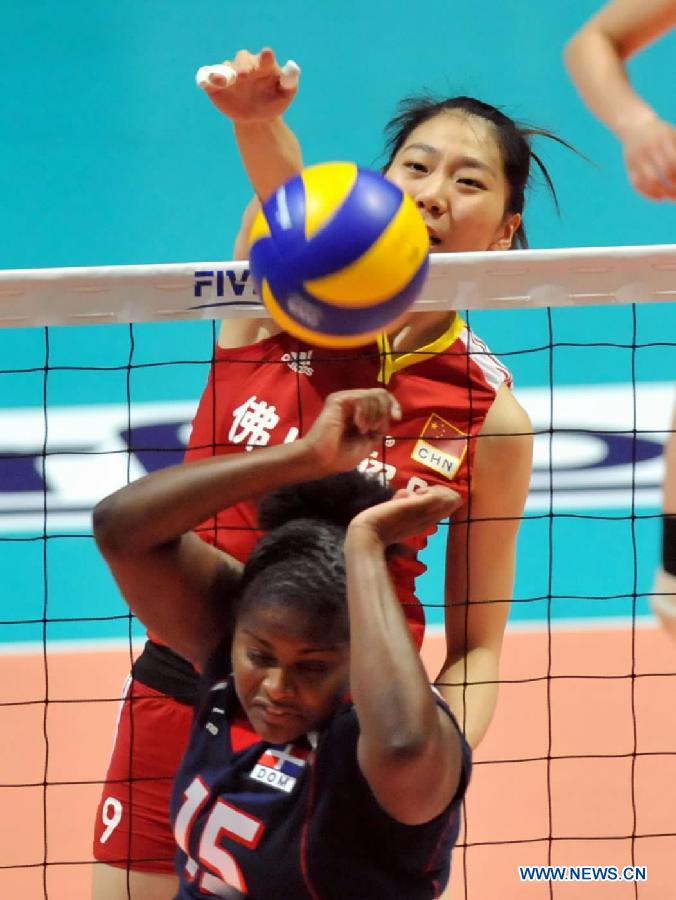 Yang Junjing (Back) of China spikes the ball during the Group I match of the women's World Grand Prix Hong Kong session between China and Dominica at Hong Kong Coliseum in Hong Kong, south China, Aug. 19, 2011. China won 3-0. [Xinhua]