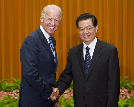 Chinese President Hu Jintao shakes hand with US Vice-President Joe Biden before their meeting at the Great Hall of the People in Beijing August 19, 2011.[Xinhua]