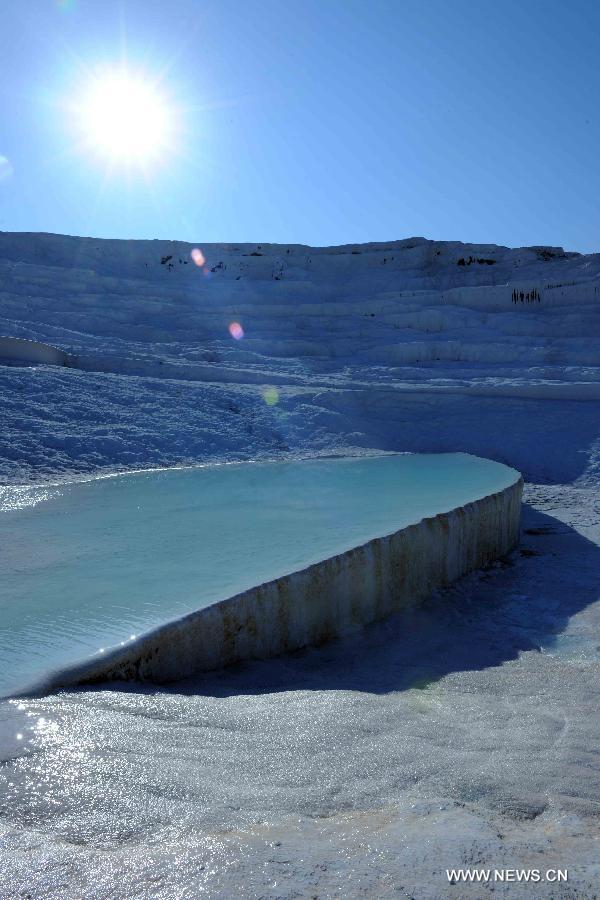 Pamukkale, meaning 'cotton castle' in Turkish, is a natural site in Denizli Province in southwestern Turkey and contains hot springs and travertines, terraces of carbonate minerals left by the flowing water. It is in total about 2,700 meters long, 600 meters wide and 160 meters high. Pamukkale was recognized as a World Heritage Site in 1988. 