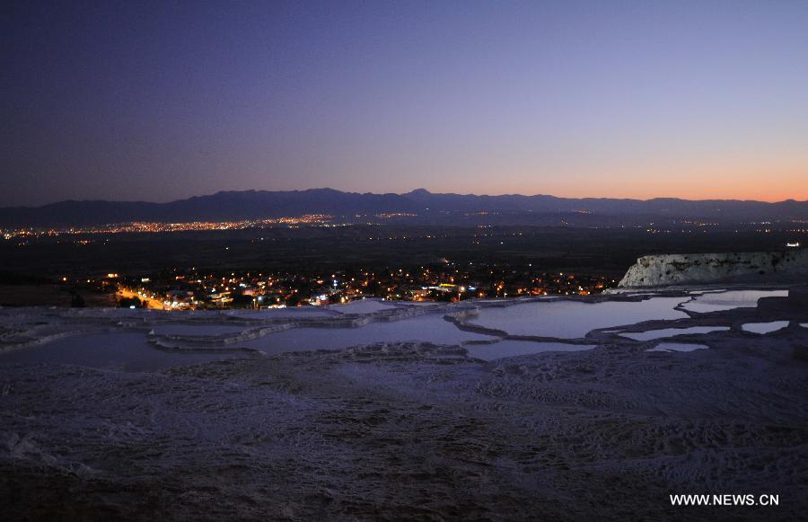 Pamukkale, meaning 'cotton castle' in Turkish, is a natural site in Denizli Province in southwestern Turkey and contains hot springs and travertines, terraces of carbonate minerals left by the flowing water. It is in total about 2,700 meters long, 600 meters wide and 160 meters high. Pamukkale was recognized as a World Heritage Site in 1988.[