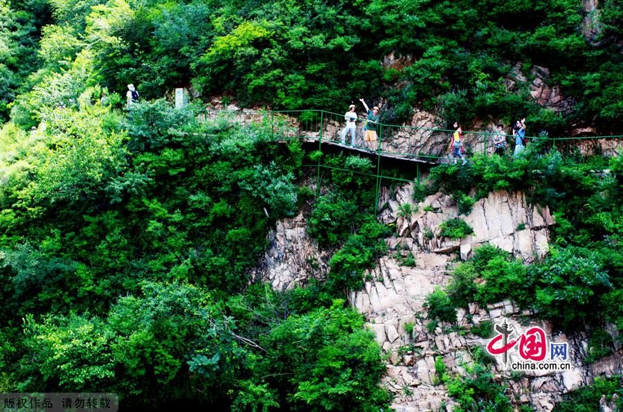 The Huanghuacheng Lakeside Great Wall Reserve, which is located in Huairou District of Beijing City, has the grandeur of the Great Wall as well as the stillness of Haoming Lake.This part of the Great Wall was the North Gate of ancient Beijing in the Ming Dynasty. Being divided by the lake, it became the only 'Great Wall in Water' in Beijing.The Huanghuacheng Lakeside Great Wall has been developed into a National 3A Scenery Site. [China.org.cn]