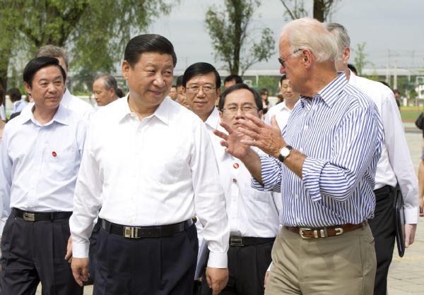 Chinese Vice-President Xi Jinping (L, front) and US Vice-President Joe Biden (R, front) visit post-quake restoration project in Dujiangyan, southwest China's Sichuan Province, Aug 21, 2011. [Photo/Xinhua] 