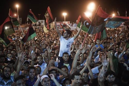 Tens of thousands of Libyans celebrate what the rebels claim to be the first uprising in Tripoli against the Kadhafi's regime on August 21, 2011 at freedom square in Benghazi, Libya. 