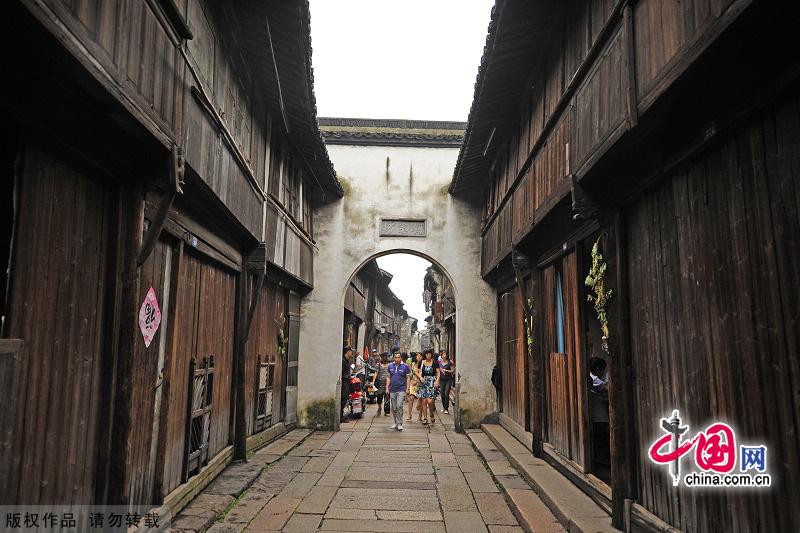 With a history of 1,200-year, Wuzhen is about one hour's drive from Hangzhou,the capital of Zhejiang Province.The small town is famous for the ancient buildings and old town layout, where bridges of all sizes cross the streams winding through the town. [China.org.cn]