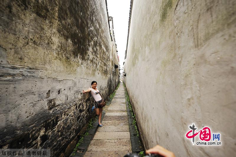 With a history of 1,200-year, Wuzhen is about one hour's drive from Hangzhou,the capital of Zhejiang Province.The small town is famous for the ancient buildings and old town layout, where bridges of all sizes cross the streams winding through the town. [China.org.cn]