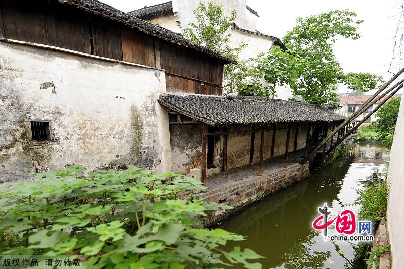 With a history of 1,200-year, Wuzhen is about one hour's drive from Hangzhou,the capital of Zhejiang Province.The small town is famous for the ancient buildings and old town layout, where bridges of all sizes cross the streams winding through the town. [China.org.cn]