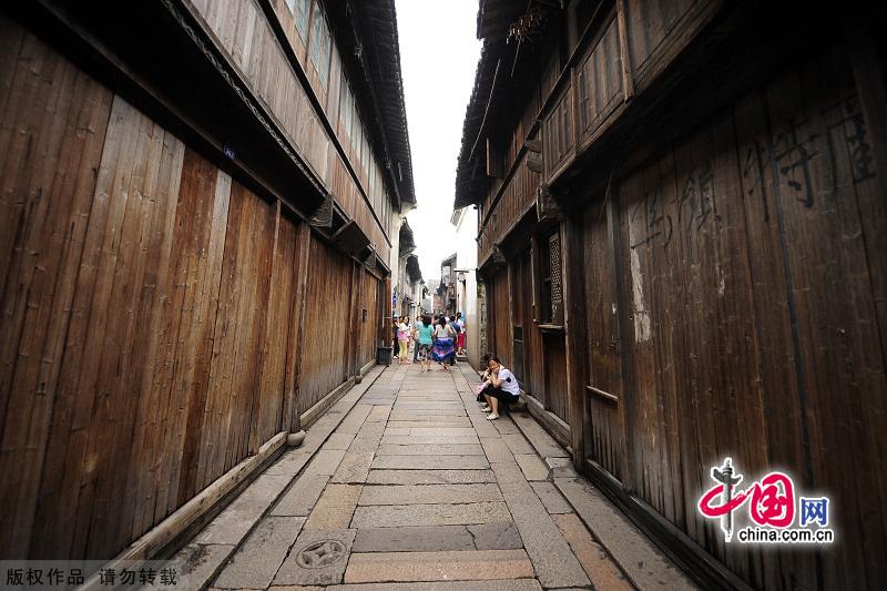 With a history of 1,200-year, Wuzhen is about one hour's drive from Hangzhou,the capital of Zhejiang Province.The small town is famous for the ancient buildings and old town layout, where bridges of all sizes cross the streams winding through the town. [China.org.cn]